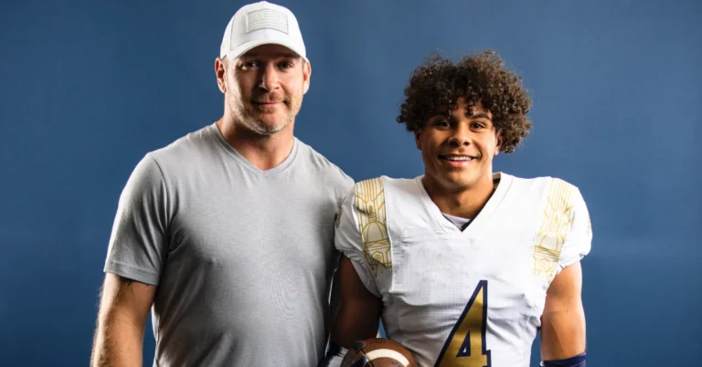Kennedy Urlacher, son of Brian Urlacher, smiling in a sports jacket outdoors.