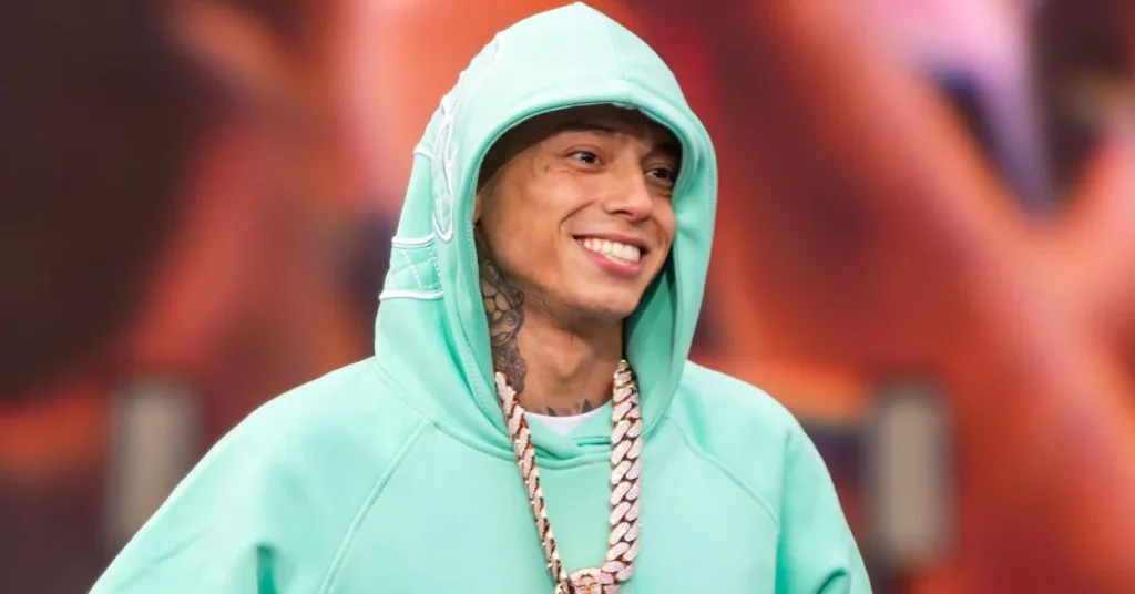 Central Cee British rapper in white jacket with calm expression on simple background