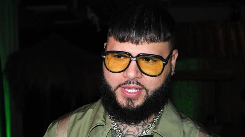 Farruko performing on stage, symbolizing his success and highlighting Farruko net worth in the reggaeton music scene.
