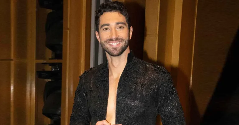Joey Graziadei smiling in a casual jacket with a plain background