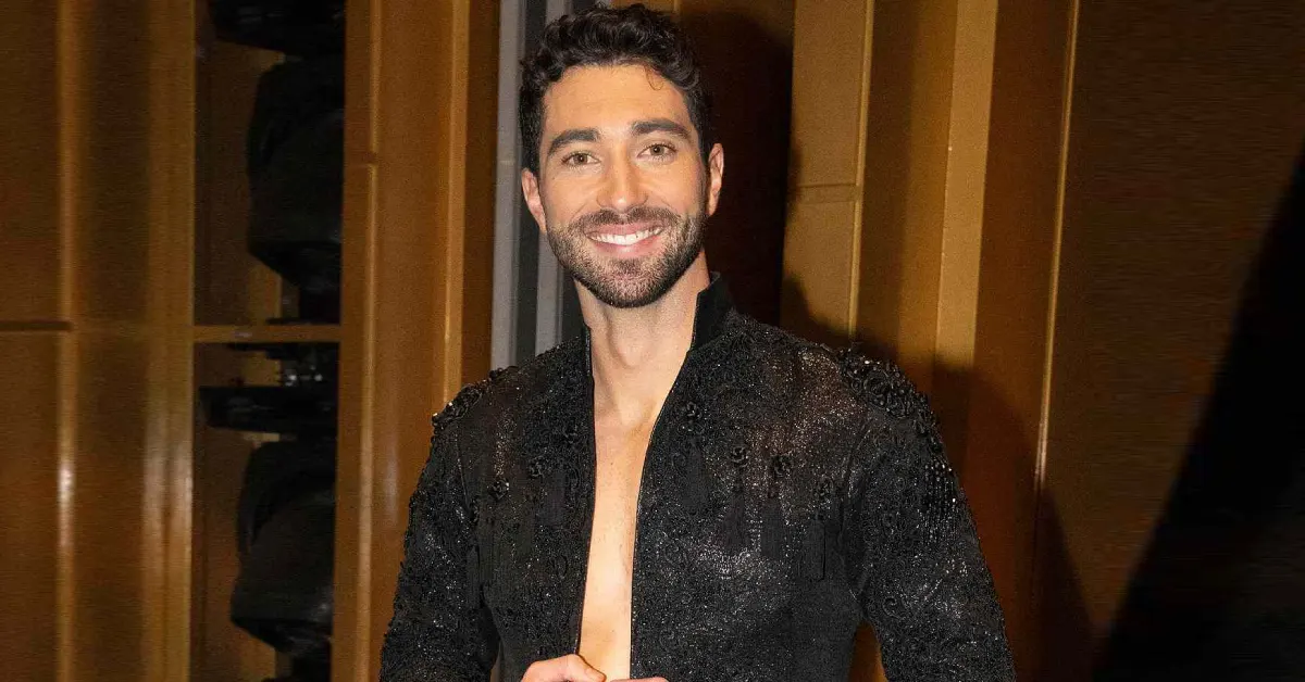 Joey Graziadei smiling in a casual jacket with a plain background
