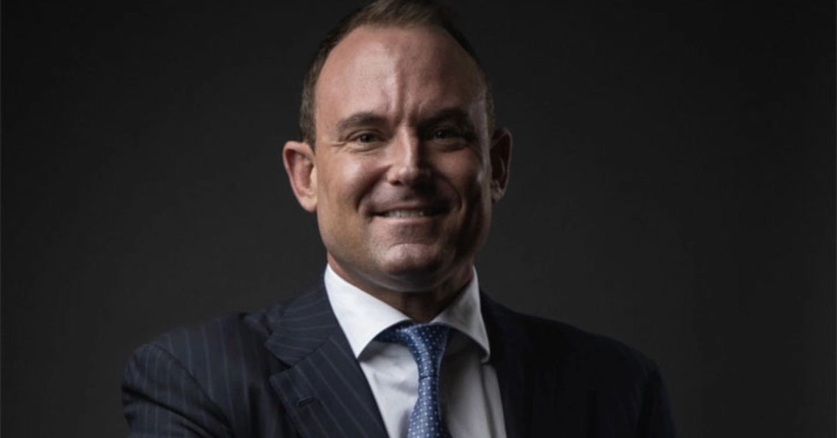 Patrick Carroll, Atlanta-based real estate entrepreneur and founder of CARROLL, standing at his Miami office — estimated net worth in tens of millions from building a $20.9 billion multifamily platform across the Sun Belt