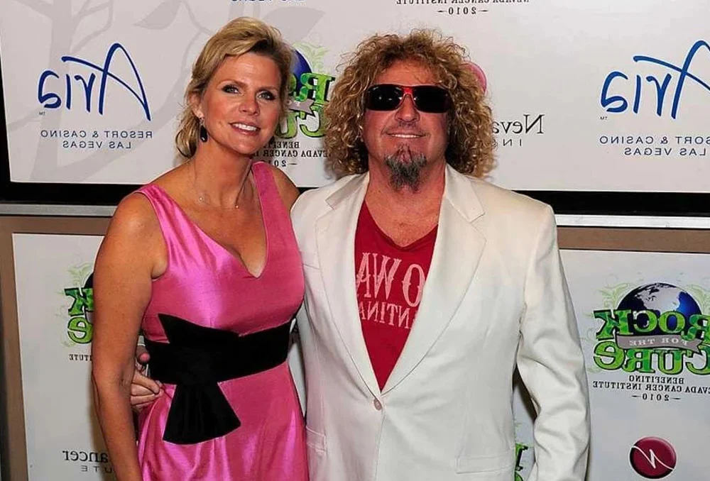 Betsy Berardi smiling during a public appearance, highlighting her graceful presence and connection to rock legend Sammy Hagar.