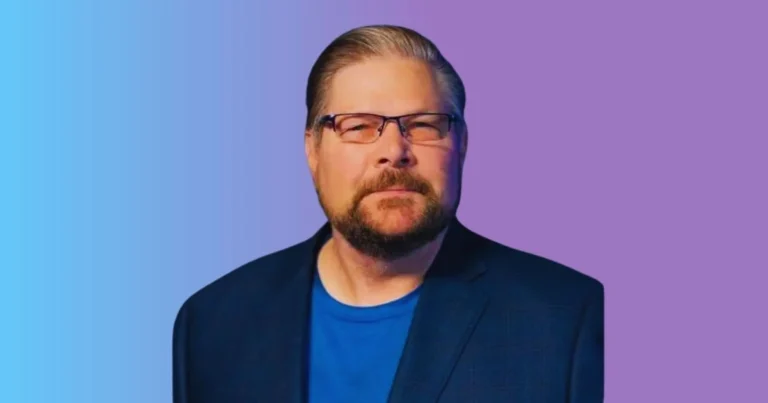 Businessman in a suit standing in front of a factory, symbolizing David Frecka net worth and his rise as a successful entrepreneur and industry leader.