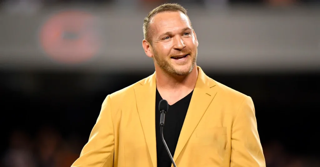 Brian Urlacher smiling at a public event after his NFL career with the Chicago Bears.