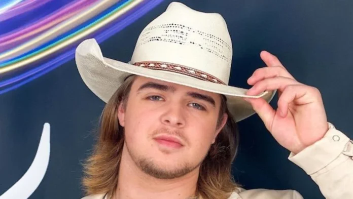 Colin Stough performing on stage with a guitar, reflecting his journey from American Idol to rising fame—ideal for an article on Colin Stough Net Worth.