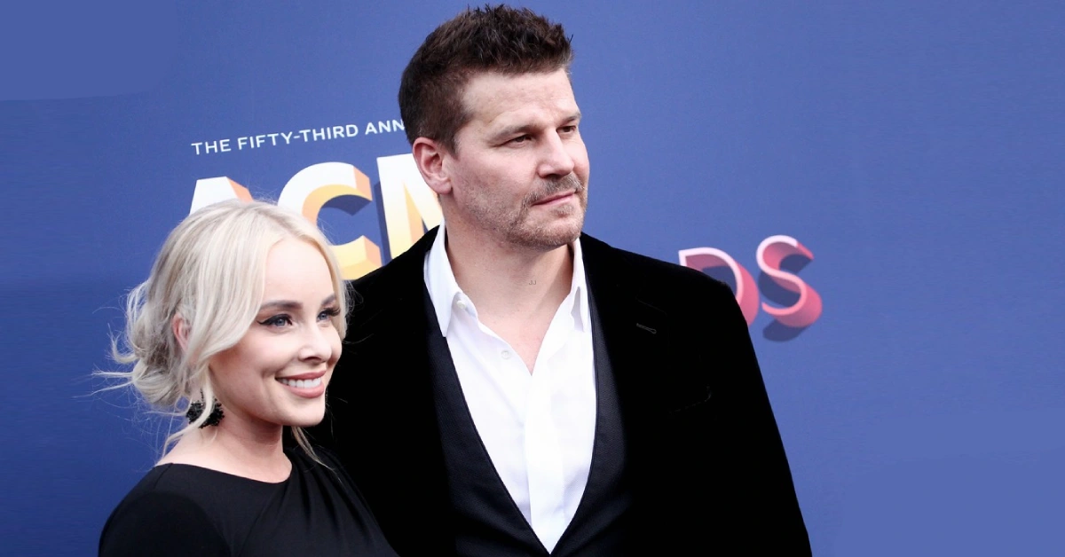 David Boreanaz and wife Jaime Bergman pose together at the ACM Awards red carpet