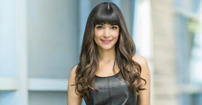 Hannah Simone Husband Hannah Simone and her husband smiling together at a red carpet event, showcasing their strong bond and elegant style – perfect for a feature on Hannah Simone Husband.