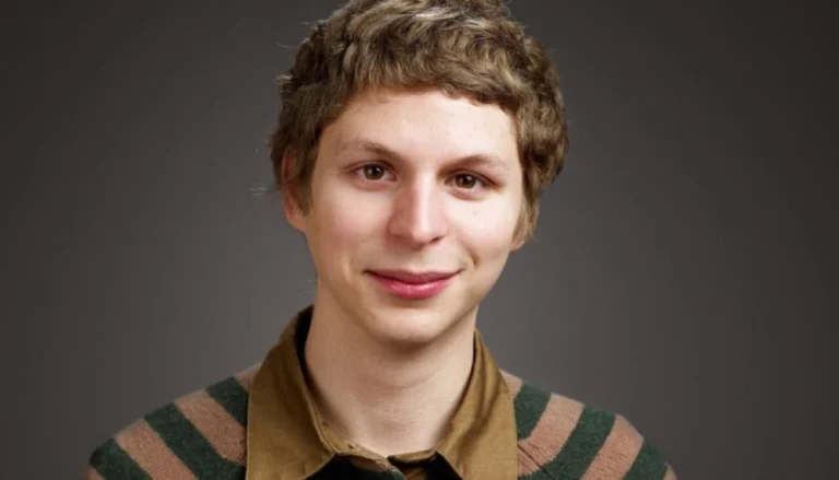 Michael Cera smiling at a public event, estimated net worth of $20 million
