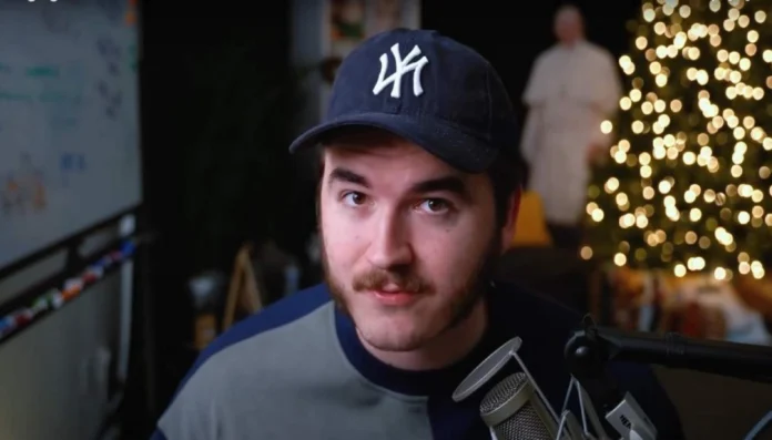 Jschlatt posing with luxury car and streaming gear, symbolizing jschlatt net worth and his rise as a top YouTuber and Twitch creator in 2025.