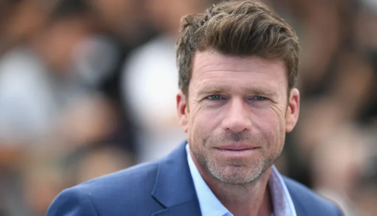 aylor Sheridan, creator of Yellowstone, standing confident — his net worth estimated at $200 million following a record-breaking $1 billion deal with NBCUniversal