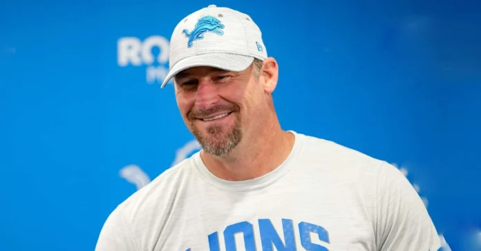 Dan Campbell Height comparison showing the Detroit Lions head coach standing tall during a game on the football field.