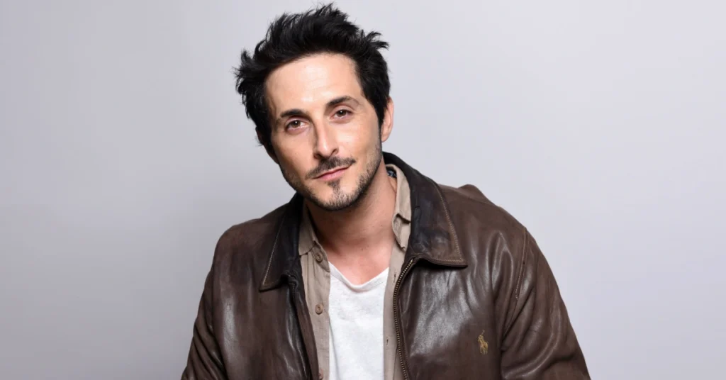 Portrait of Tomer Capone, the Israeli actor recognized for his breakout role as Frenchie in The Boys, highlighting his career journey and global success.
