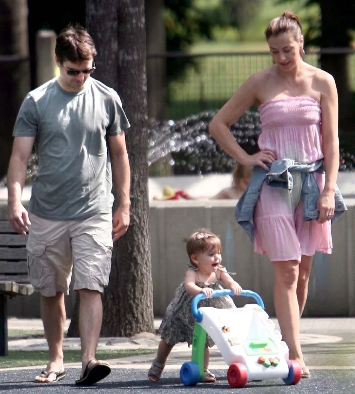 Toddler Ella Sofia Gordon taking her first steps with a push walker alongside her parents, Jeff Gordon and Ingrid Vandebosch, in a park (2008).