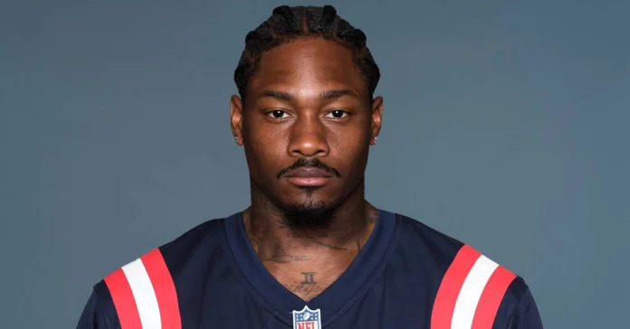 Stefon Diggs celebrating on the football field in his team uniform, highlighting the energy, passion, and success that define Stefon Diggs’ NFL career.